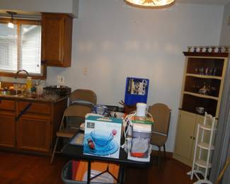 This kitchen holds a treasure trove of items, and small appliances, all neatly packed and stacked