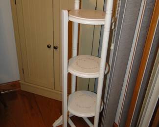 Three tier stand to hold whatever it s that you want to put on there.  African violets would look nice