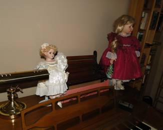 We have two very nice collector's dolls