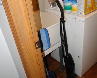 The laundry area holds cleaning supplies and daily cleaning items as well