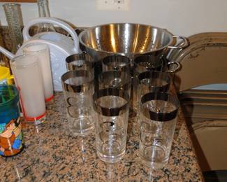 We have a nice eight piece glass set with silver trim and the letter "E"