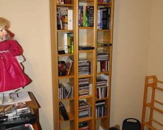 Three tall towers to hold DVD's, CD's and VHS tapes