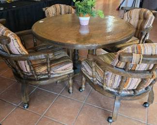 Comfortable Game or Breakfast Table with Four Rolling Chairs