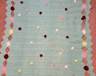 crochet blanket with. pop-poms