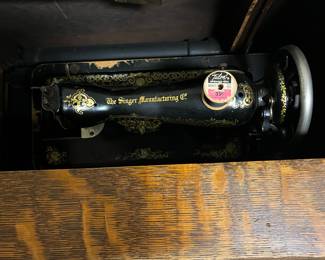 Singer sewing machine cabinet with machine $6,000