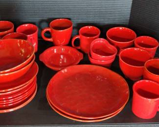 Various Red Dishes And Mugs And Trays 