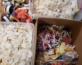 more large tubs of  trim and ribbon one is all eyelet trim another is white lace type trims and one is multi colored different trims
