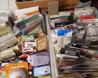stickers, punches, paper, stamps, embelishments etc, there are several large full tubs of rubber stamps and many containers like this that not pictured with scrapbooking and craft supplies