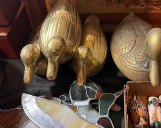 three tables of duck decor