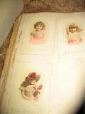 Victorian Postcards inside scrap book