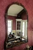 Antique mirror with carved mahogany frame