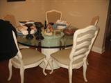 Century glass table top with 5 chairs.
