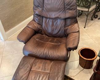 Pair of distressed Ekornes stressless leather chairs. 
