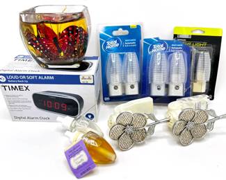 New In Box Timex Alarm Clock, Night Lights Including Scented Flowers By Wallflowers & New Gel Candle
Lot #: 177