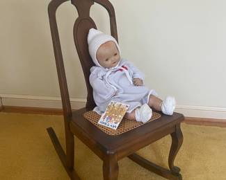 Antique rocking chair and baby doll