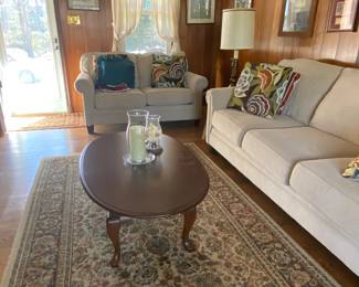Sofa and loveseat set, oval coffee table and rug