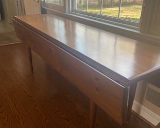 Large harvest table with sides folded down