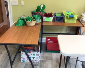 Corner desk, glass candle holders, st Patrick’s items. Table & 2 folding chairs not for sales.