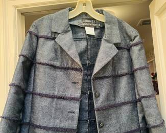 Classic Chanel denim and black fringe piping jacket.