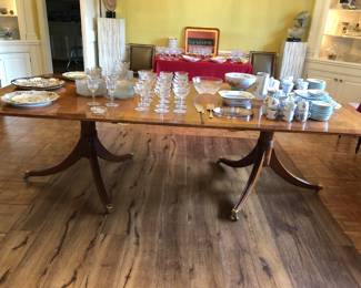 English mahogany double pedestal dining table with brass accents and 1 more leaf