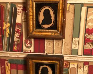 Too early silhouette pictures, possibly Franklin and Washington