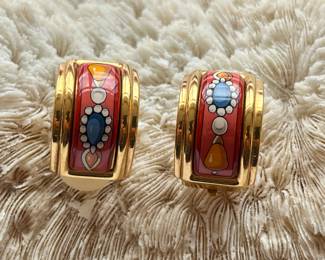 A pair of gold tone Hermes style clip earrings. 