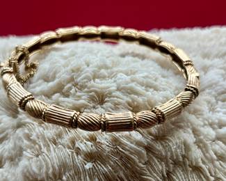 A vintage 14k textured twisted bangle bracelet.