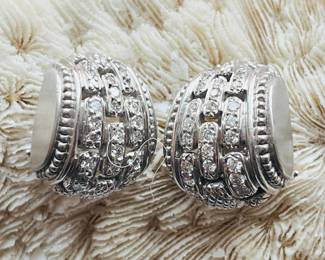 A vintage pair of Judith Ripka, 18 karat diamond crested huggie style earrings. 