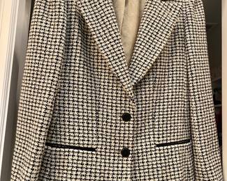 Iconic Black and white tweed houndstooth Chanel jacket.