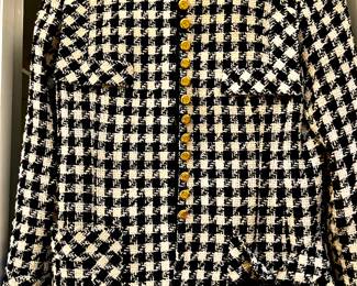 Classic black-and-white houndstooth tweed Chanel jacket. 