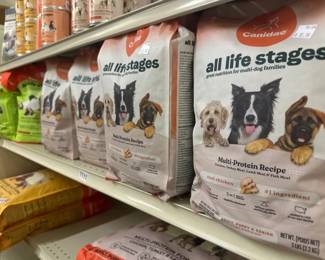 APPROX 20 BAGS OF 5LBS BAGS OF DOG FOOD