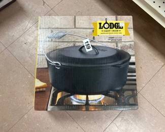 2 LODGE 9IN CAST IRON SKILLETS AND DUTCH OVEN