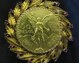 1 oz. 22K gold coin surrounded by 14K & rubies
