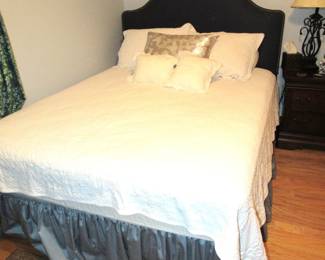 Queen bed with padded headboard