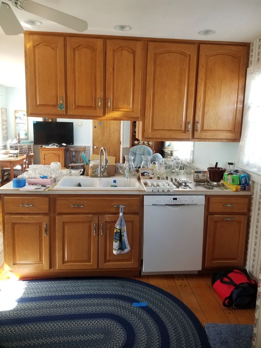 Well maintained kitchen with handsome wood cabinets