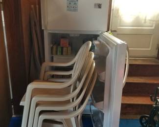Garage fridge; patio chairs