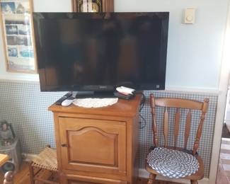 Flat screen tv; wood cabinet