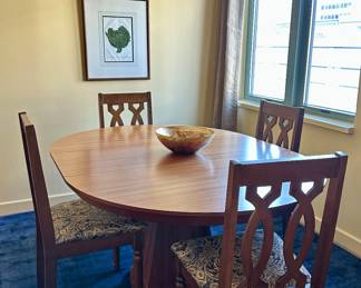 Solid Teak 4-Foot Round Pedestal Base Dining Table and 4 Chairs. Table is 29"H x 48" diameter and comes with one 16" leaf (shown).  