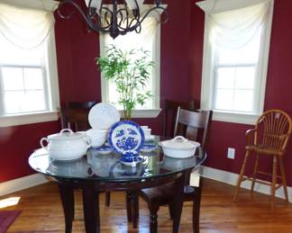 Round glass top table with 4 chairs