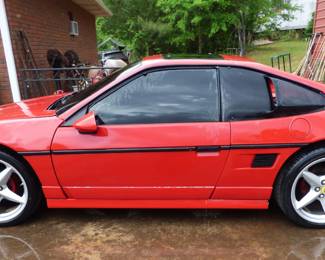 1986 Pontiac Fiero with Ferrari Wheels. Leaking coolant, Drivers Side window "as is",  Passenger Side door does not open from outside, door liner in trunk.  Interior "AS IS".  Accepting bids starting at $1750 through Saturday, May 3 @ 2:30