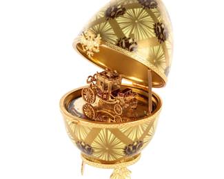 Lot 202: Limoges Faberge Coronation Egg with Carriage