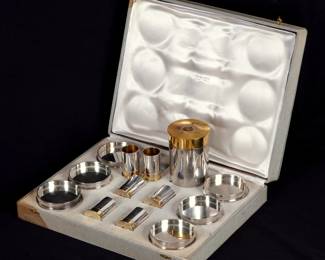 Lot 115: Hermes Chrome and Gold Plated Bullet Smoking Set