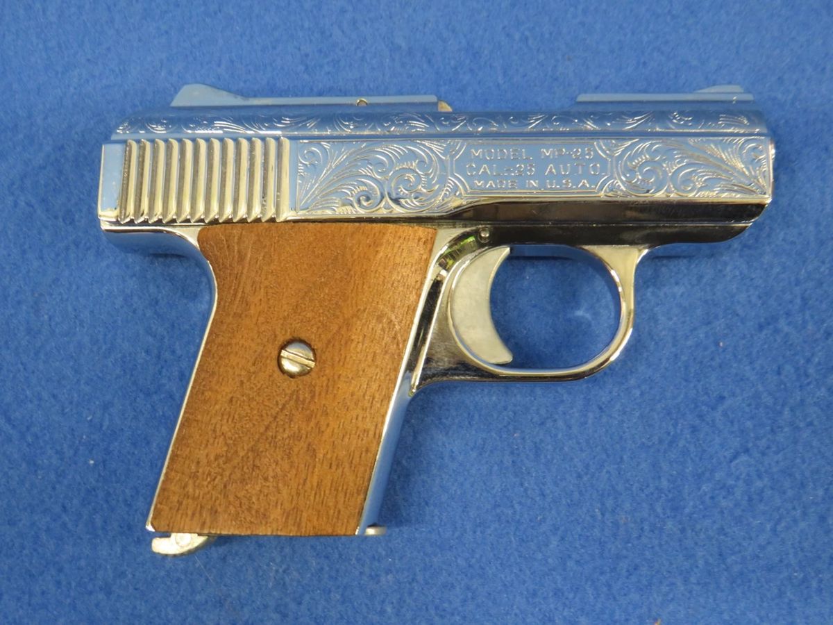 Lot 9. Raven Arms .25 semi-auto pistol. Ser. No. 1032910. Chrome-plated, wooden grips, and a velvet-lined case.