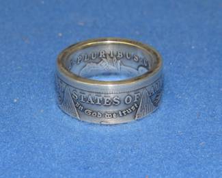 Lot 260. 1921 Morgan silver dollar ring. Size 10.5-11. 21.26 grams.