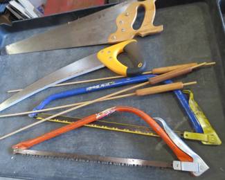 Lot 123. Four saws and wooden cattails