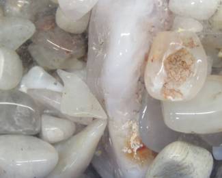 Lot 93. Polished rocks, plus part 1 of joke: Where do squirrels go in a tornado? (See next lot.)