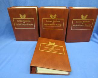 Lot 451. 22kt gold-plated replicas of US Stamps with First Day of Issue cachets. Approx. 250 stamps in four binders. Includes Sterilite tote.