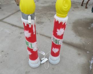 Lot 157. 38" lighted Noel candles. Both work. Need bulbs.
