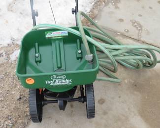 Lot 208. Fertilizer spreader and garden hose