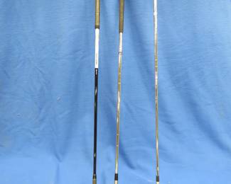 Lot 129. Rolling golf cart, 2 Taylor-Made irons, and Spaulding 7 metal wood